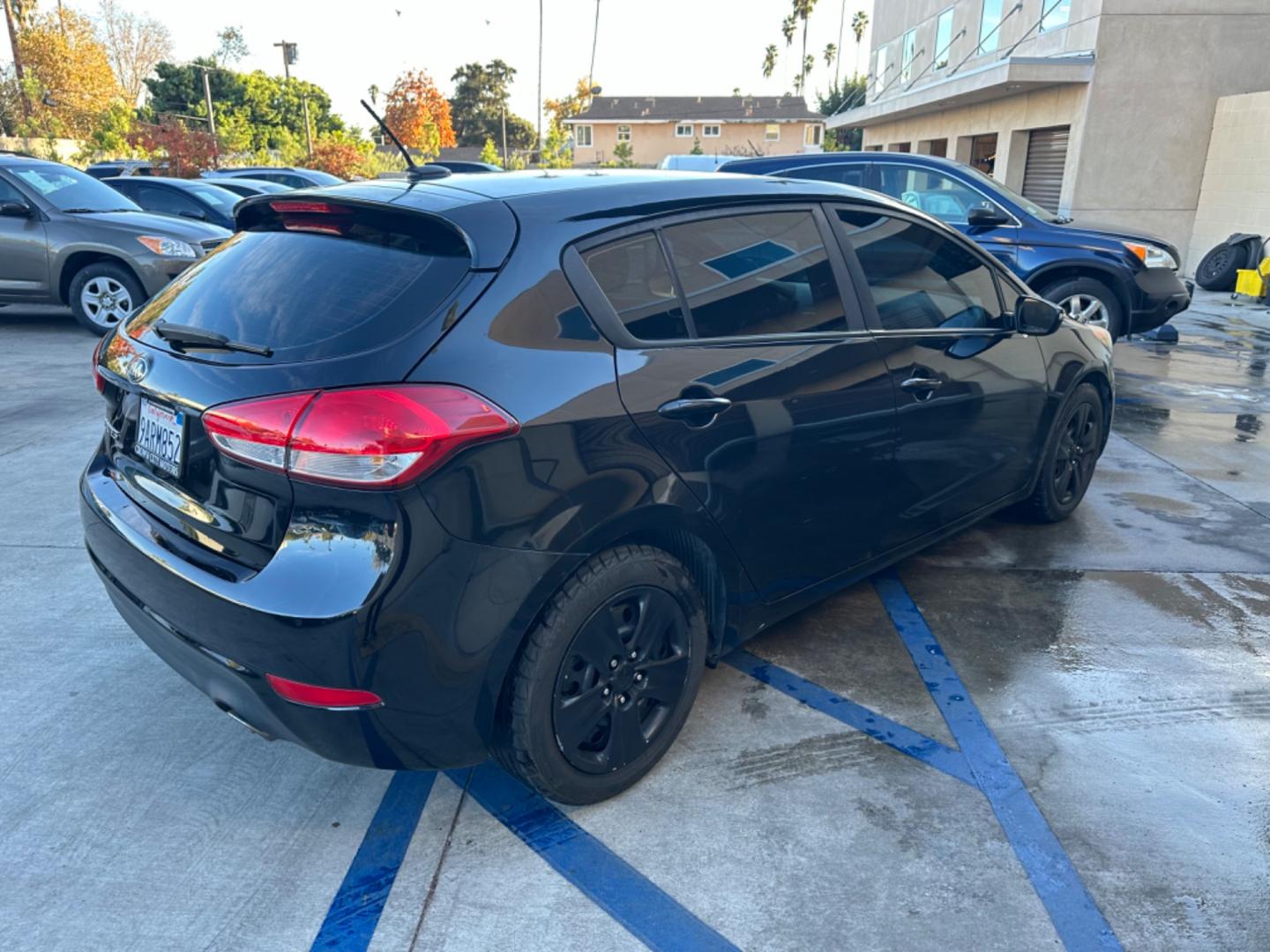 2016 Black /Black Kia Forte 5-Door Cloth (KNAFK5A87G5) with an 4 CYLINDER engine, Automatic transmission, located at 30 S. Berkeley Avenue, Pasadena, CA, 91107, (626) 248-7567, 34.145447, -118.109398 - Embark on a Journey of Style and Efficiency with the 2016 Kia Forte Hatch - Now Available at Our Premier Pasadena, CA Dealership Welcome to our BHPH dealership in Pasadena, CA, where we proudly present the 2016 Kia Forte Hatch, a vehicle that seamlessly blends stylish design, modern technology, a - Photo#4